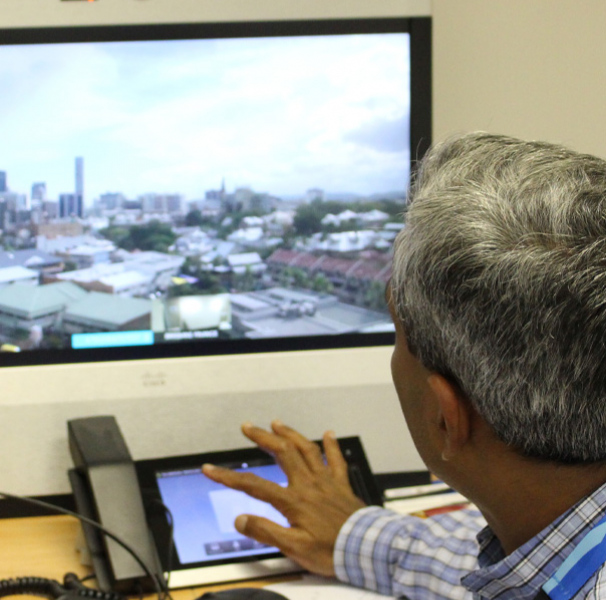 Medical oncologist Dr Sabe Sabesan looking at computer screen