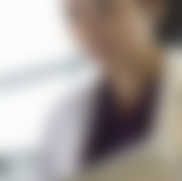 Woman in white gown looking at computer