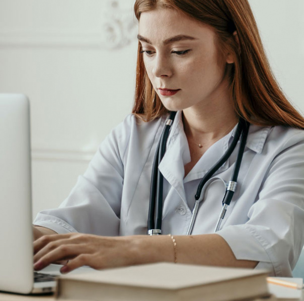 Female doctor using laptop