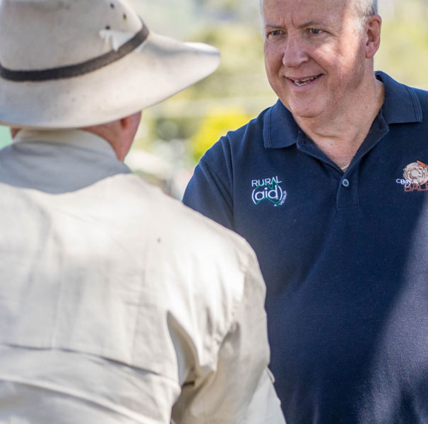 Rural Aid counsellor Gary Bentley meets with a farmer.