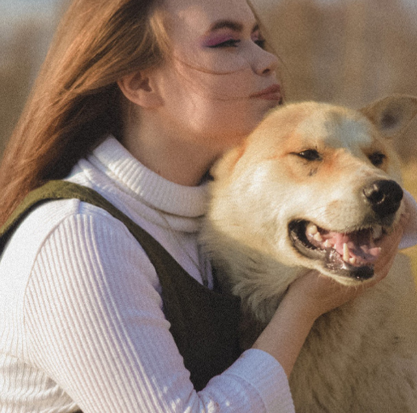 Woman holding dog