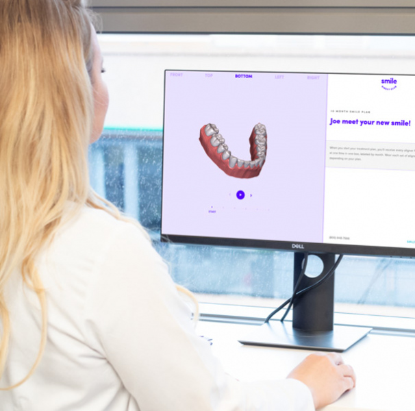 Woman using dental software