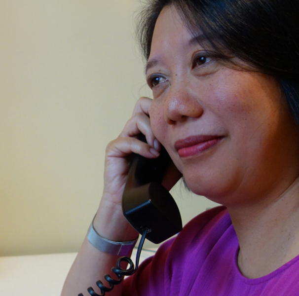 Woman on a corded phone