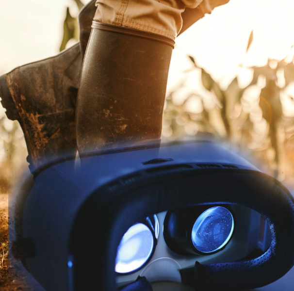 Legs with boots in corn field foreground virtual reality goggles