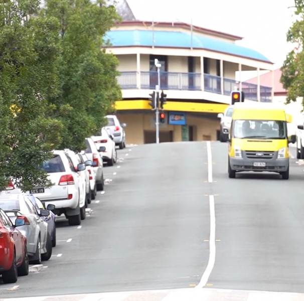Rural town street with cars