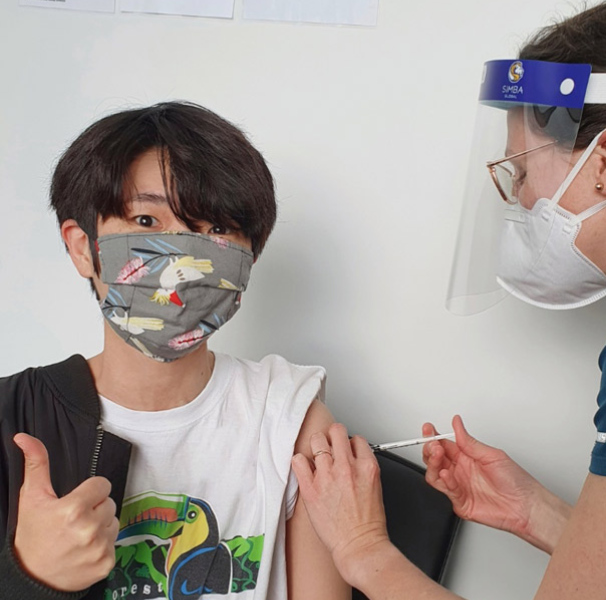 Miss Jeon receiving her COVID-19 vaccine at a local centre.
