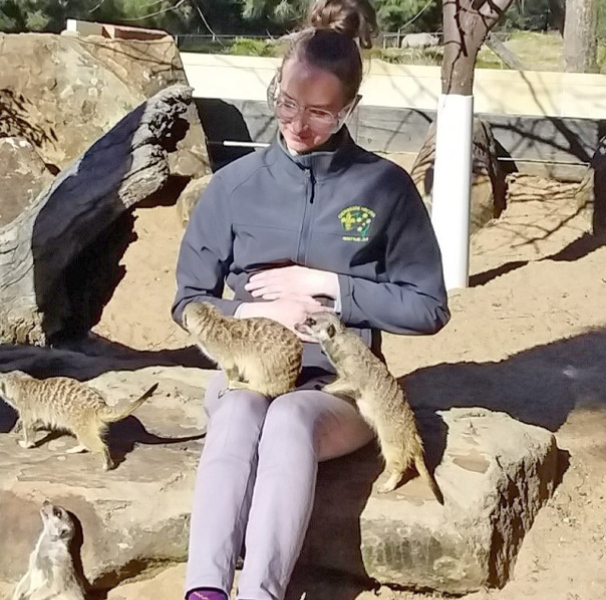 Dr Julia Buras enjoys an encounter with the meerkats at Taronga Western Plains Zoo in Dubbo. [Image: Julia Buras]