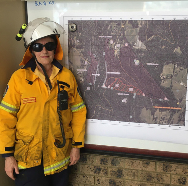Mature woman in firefighting clothing