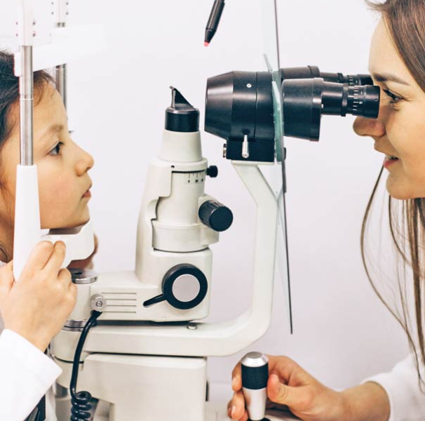 Little girl checking up her sight at ophthalmology center