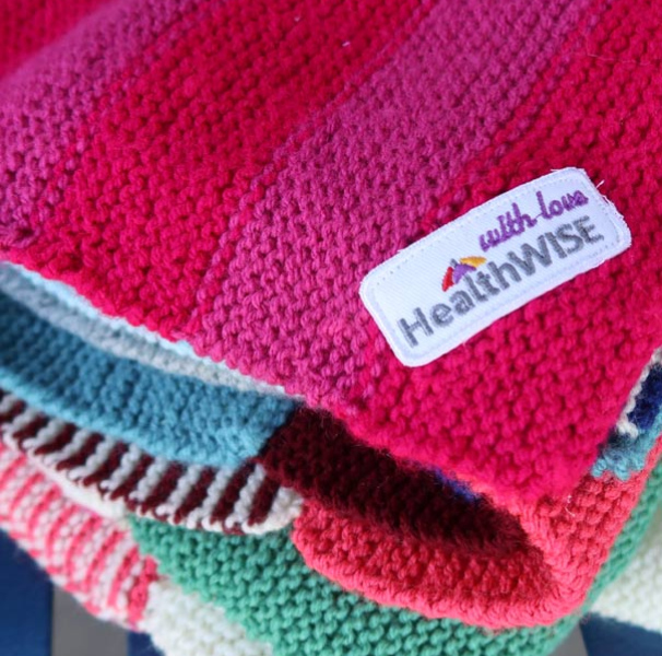 Bright folded Health Wise labelled blankets