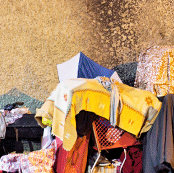 Assortment of personal belongings on a footpath