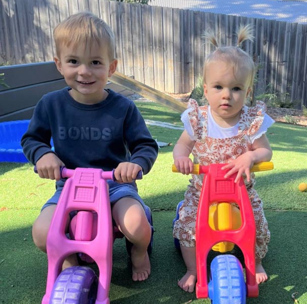 Henley and Vivienne race their borrowed trikes. Photographer: Bridget Sarah