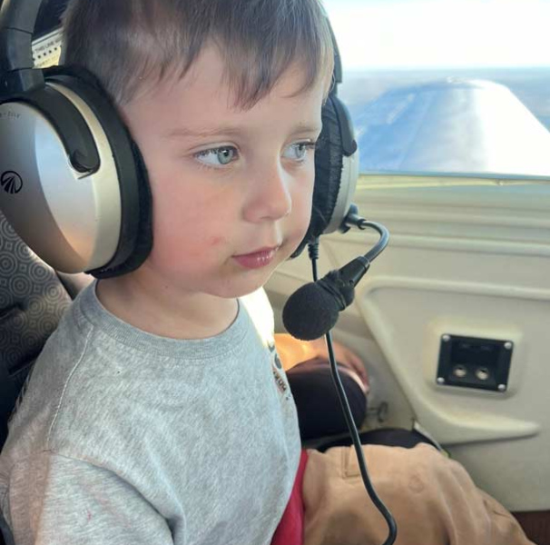 Nate on Angel Flight wearing a headset