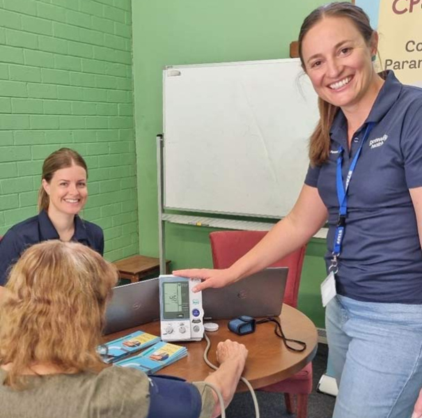 Community Paramedics Lauren Rudd and Alicia Turnbull undertake a health assessment as part of Gateway Health’s CP@Clinic.