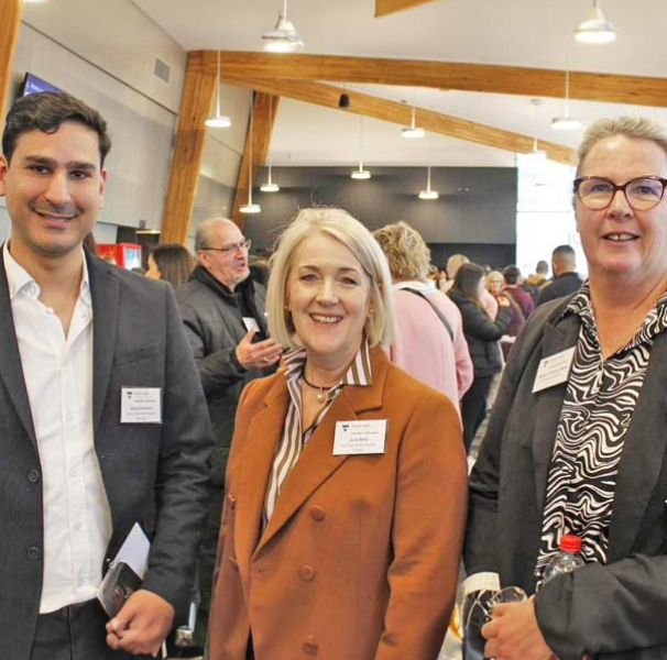 Three people at an event
