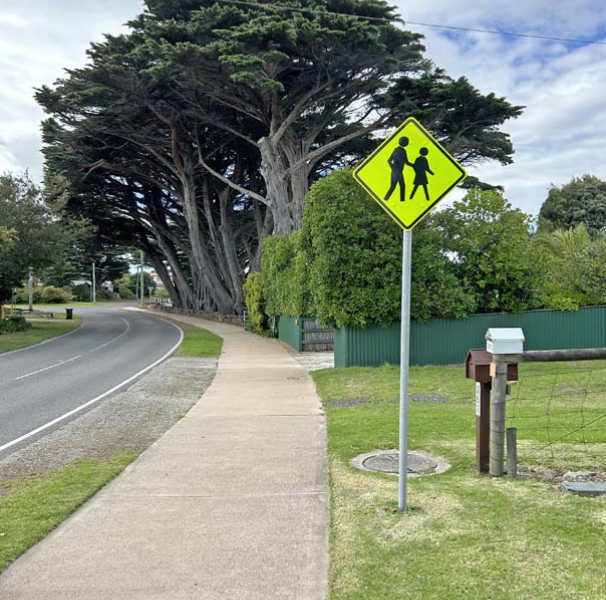 Rural street with pedestrian sign