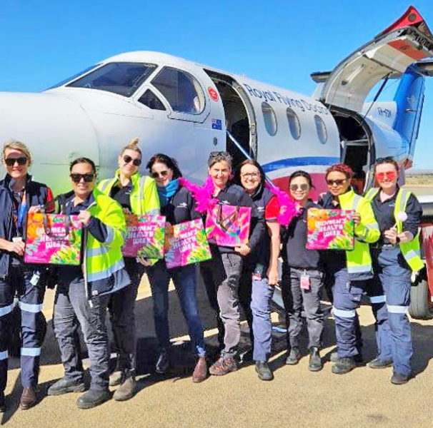 Women's Health Week group photo by a RFDS aircraft