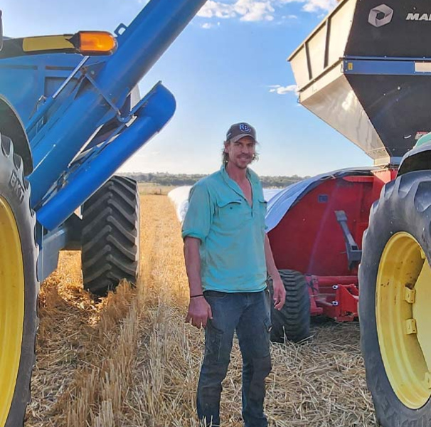 Justin Koschitzke in the wheat field with tractors