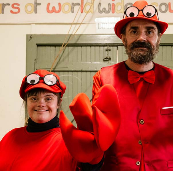 Street performers dressed as red lobsters