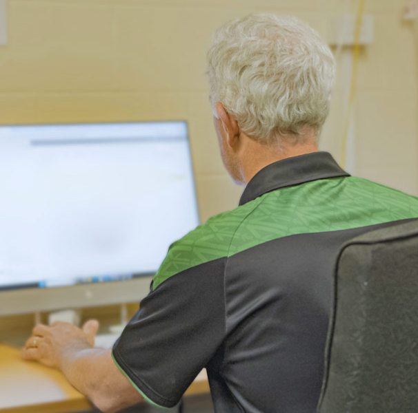 A man using a computer at a desk