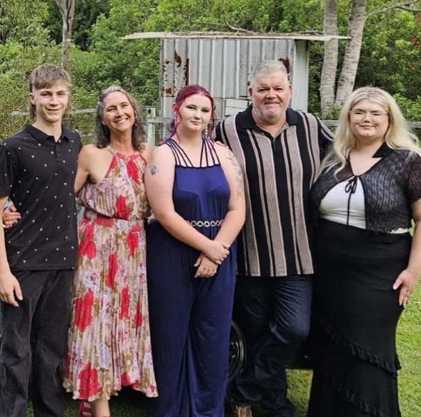 Five people posing for family photo - Justine pictured with her family – Korbyn (16), Justine, Tianna (18) Gary (husband), (Shalia 24)
