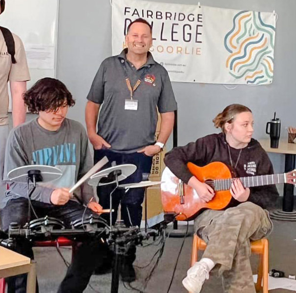 Group of high school students playing music with Lindsay Ginn